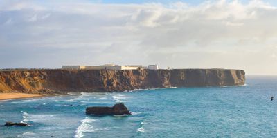 Sagres Fortress promontory jutting into the Atlantic and the whitewashed church visible against the ocean