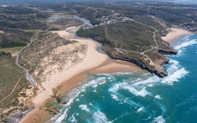 Aerial view of the Praia da Amoreira estuary and beach from above