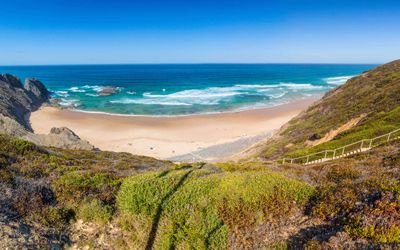 Vast expanse of golden sand at Praia da Bordeira on the Costa Vicentina