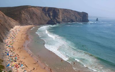 Arrifana beach in its natural amphitheatre of cliffs