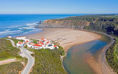 Praia de Odeceixe bay showing the calm river lagoon alongside the Atlantic ocean