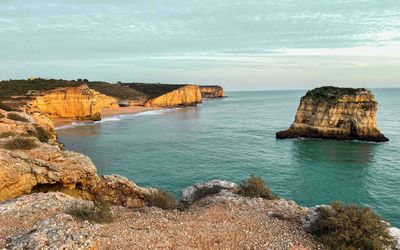 Western end of Praia dos Caneiros with rock stacks and quieter coves