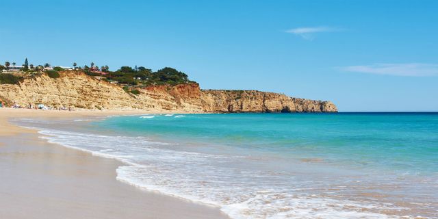 Praia do Porto de Mós - A spacious golden beach backed by dramatic ochre cliffs