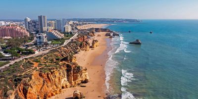 Praia da Rocha golden sands backed by ochre cliffs and rock formations
