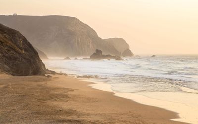 View towards the cliffs in Praia da Cordoama and its surf breaks
