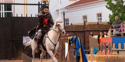 Knight on horseback ready for jousting at Silves Medieval Fair