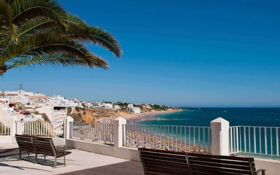 View across Albufeira's coastline with turquoise waters and golden sandy beaches