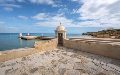 The 17th-century Forte da Ponta da Bandeira guarding the harbour entrance in Lagos