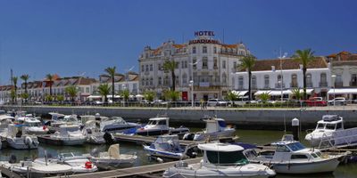 Vila Real de Santo António marina with Hotel Guadiana and palm-lined waterfront promenade