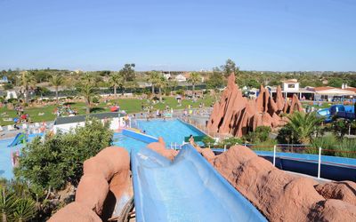 Riders racing down the Banzai mat slide at Slide & Splash