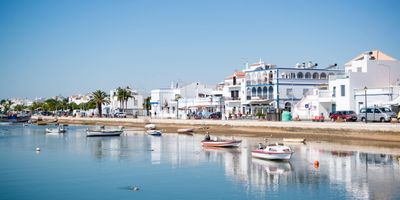 Santa Luzia waterfront with fishing boats moored along the harbour
